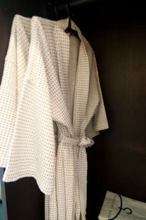Two white bathrobe coat hangerの写真素材