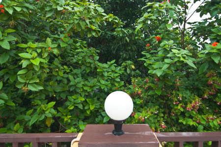 Garden lamp on wood  pillar の写真素材