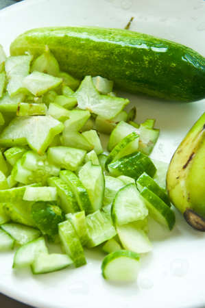 sliced cucumber in dish for cookの写真素材