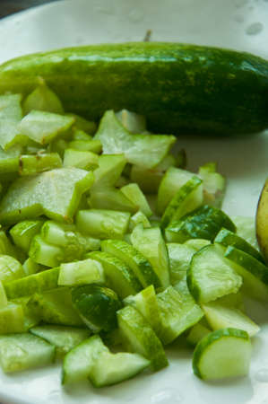 sliced cucumber in dish for cookの写真素材