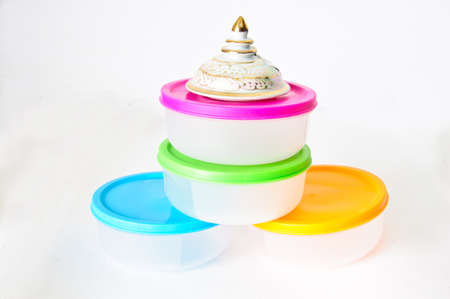 Colourful plastic containers isolated on a white backgroundの写真素材
