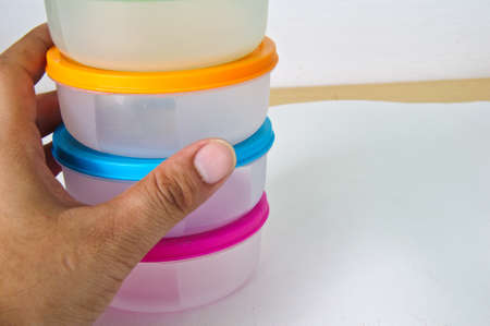 Set round plastic container on white background