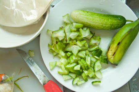sliced cucumber in dish for cookの写真素材