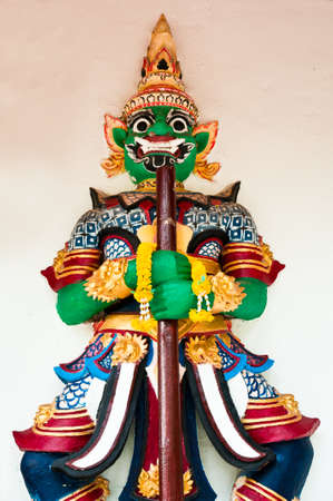 Old Thai giant sculpture on cement wall in Thai  templeの写真素材