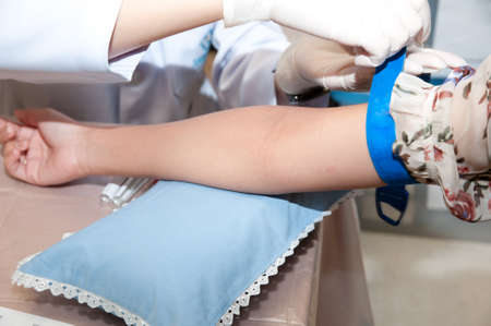 Real drawing blood procedure in medical laboratoryの写真素材