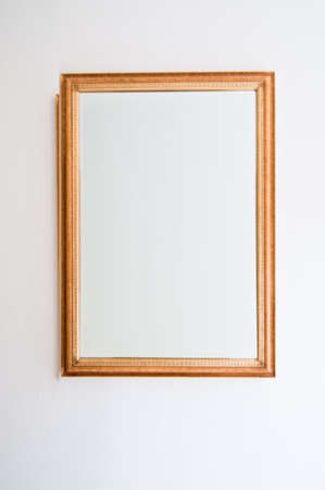 Classic wooden  picture frame on wallの写真素材