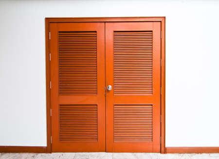 close a brown wooden door