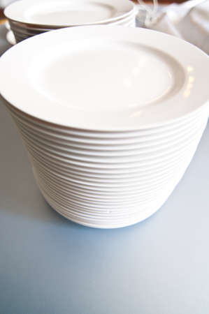 Stacks of white platesの写真素材