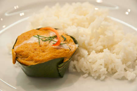 Steamed fish with curry paste Thai Food in riceの写真素材
