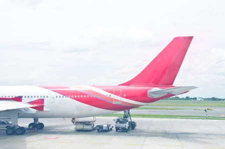 Commercial passenger aircraft, ready for boarding on the landing strip of an airportのeditorial素材