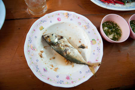 fried mackerel fishes on white plate