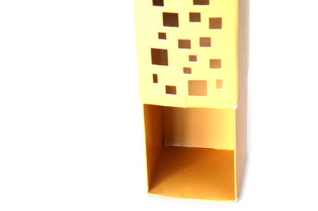 Empty open yellow paper box isolated on white backgroundの写真素材