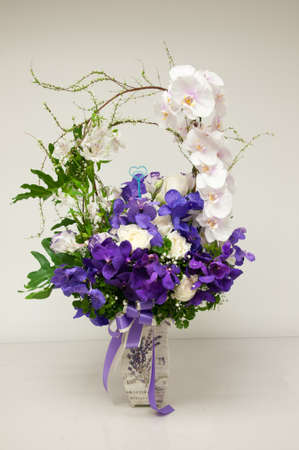 Bouquet of orchid in a vaseの写真素材