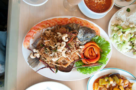 Thai food -fried fish in dining tableの写真素材