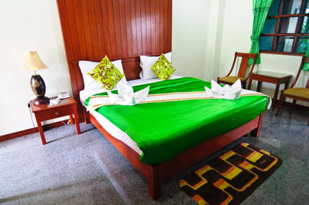 Green bedroom ready for guests green blanketのeditorial素材