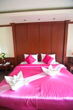 Typical hotel room with queen size pink bad with Thai styleのeditorial素材