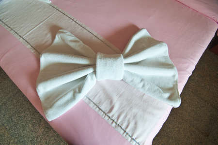 bow made from towels in the hotel on bedのeditorial素材