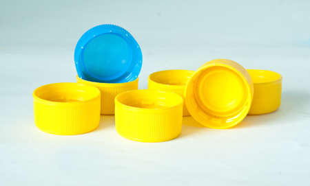 yellow plastic bottle screw caps used to seal plastic bottlesの写真素材