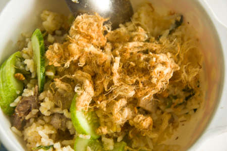 Fried rice with dried shredded pork on white dishの写真素材