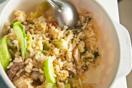 Fried rice with pork on white dishの写真素材