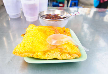 Vietnamese stuffed crispy omelette on table