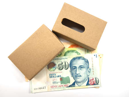 singapore dollars and paper box on white blackground
