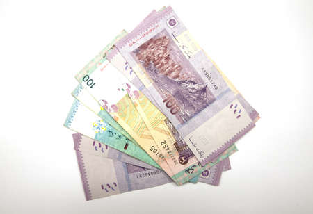 A wad of Malaysian Ringgit currency notes in multiple denominations.の写真素材