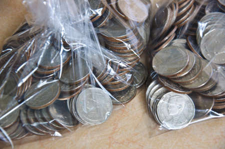 count money in plastic bag prepare for exchange