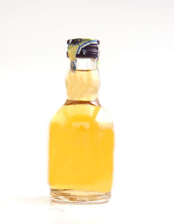 Beautiful Whisky Bottle against well lit backgroundの写真素材