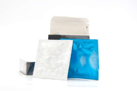 Condom in foil on a white backgroundの写真素材