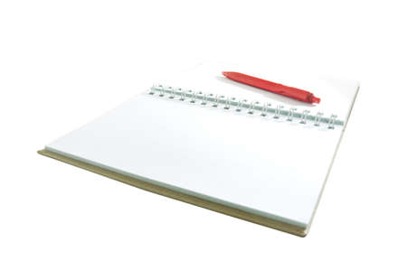 red pen on notebook on whiteの写真素材