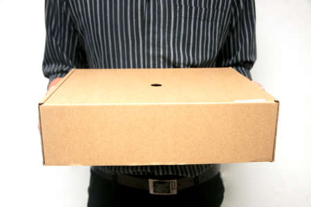 Man in  black shirt carry recycle paper box hand underの写真素材