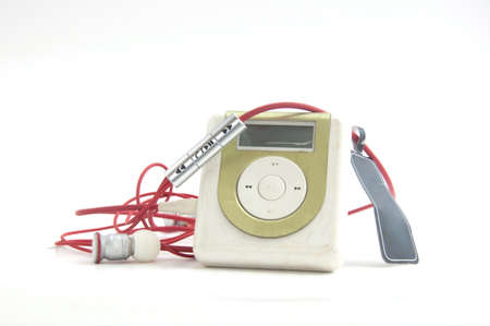 Green Metallic MP3 player and red earpieceの写真素材