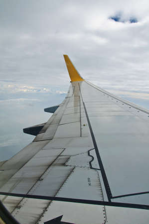 Wing of airplane from windowの写真素材