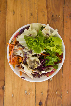 Fresh salad on table woodの写真素材