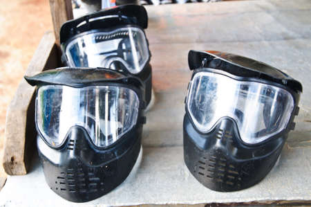 Paintball mask on rustic wooden backgroundの写真素材