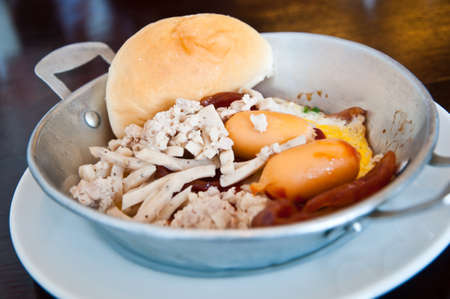 Fried egg stuff with hot panの写真素材