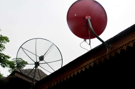 Two Satellite dish on roofの写真素材