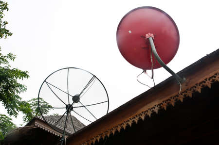 red Satellite dish on roofの写真素材