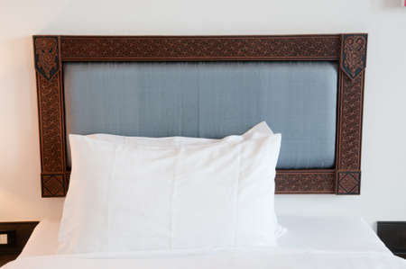 White pillows on a bed Comfortable soft pillows on the bedの写真素材