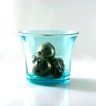 Christmas toys -bell  in blue glassの写真素材