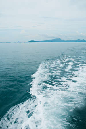 Cruise ship trails in open seaの写真素材