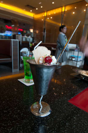 Ice cream with strawberries and whipped creamの写真素材