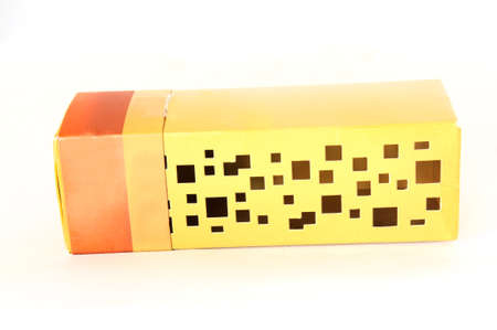 gold cardboard box isolated on a white backgroundの写真素材
