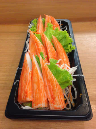 Crab stick on black containerの素材