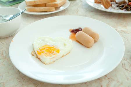 Breakfast - egg and sausageの写真素材