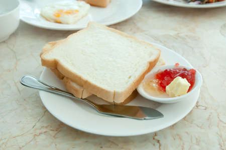 Breakfast - toasts and strawberry jamの写真素材