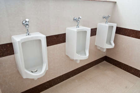 The modern style decorative restroom interior with white urinal row.の写真素材