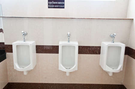 The modern style decorative restroom interior with white urinal row.の写真素材