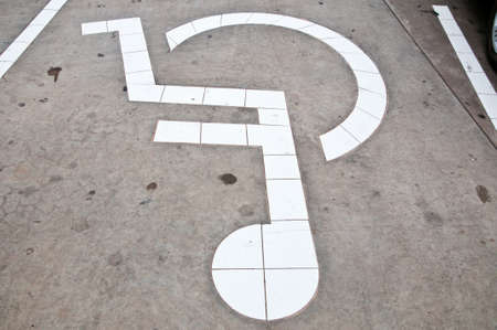 Disabled Parking Sign on roadの写真素材